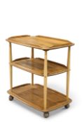 AN ERCOL LIGHT ELM TEA TROLLEY