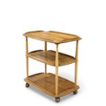 AN ERCOL LIGHT ELM TEA TROLLEY