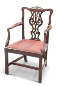 A GEORGE III MAHOGANY "CHIPPENDALE" OPEN ARMCHAIR