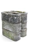 A GROUP OF SIX COMPOSITE STONE PLANTERS