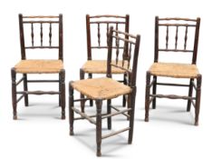 A SET OF FOUR RUSH-SEATED OAK DINING CHAIRS, EARLY 19TH CENTURY