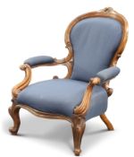 A VICTORIAN WALNUT AND UPHOLSTERED ARMCHAIR