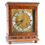 AN EARLY 20TH CENTURY WALNUT MANTEL CLOCK