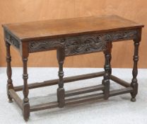 A CARVED OAK SIDE TABLE