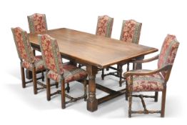 A PERIOD-STYLE OAK REFECTORY DINING TABLE AND EIGHT CHAIRS