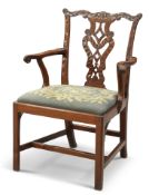 A GEORGE III MAHOGANY "CHIPPENDALE" OPEN ARMCHAIR