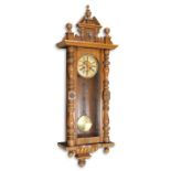 A 19TH CENTURY GERMAN WALNUT VIENNA WALL CLOCK