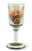 A 19TH CENTURY ARMORIAL GREEN GLASS TOT