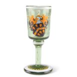 A 19TH CENTURY ARMORIAL GREEN GLASS TOT