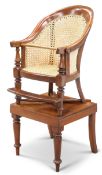 A VICTORIAN MAHOGANY AND CANEWORK BERGÈRE CHILD'S HIGHCHAIR ON STAND