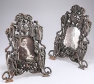 A PAIR OF ORNATE VICTORIAN COPPER EASEL PHOTOGRAPH FRAMES