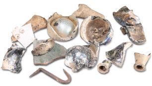 A GROUP OF ROMAN GLASS FRAGMENTS