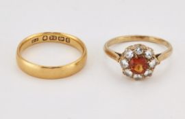 A 22 CARAT GOLD BAND RING, AND A CITRINE AND PASTE CLUSTER RING