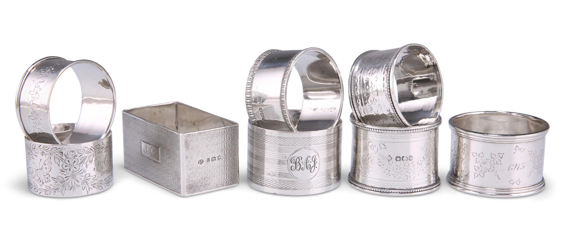 EIGHT ASSORTED SILVER NAPKIN RINGS