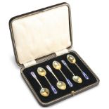 A SET OF SIX GEORGE VI SILVER-GILT AND ENAMELLED TEASPOONS