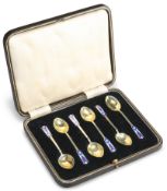 A SET OF SIX GEORGE VI SILVER-GILT AND ENAMELLED TEASPOONS