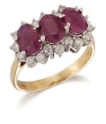 AN 18 CARAT GOLD RUBY AND DIAMOND CLUSTER RING