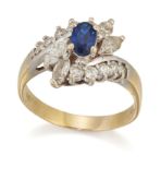 AN 18 CARAT GOLD SAPPHIRE AND DIAMOND CLUSTER RING