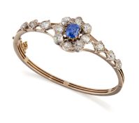 A LATE 19TH CENTURY SAPPHIRE AND DIAMOND BANGLE