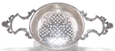 A GEORGE II SILVER PUNCH STRAINER