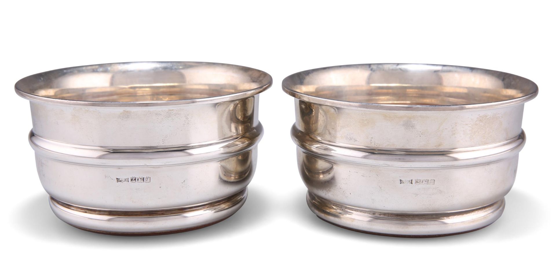 A PAIR OF ELIZABETH II SILVER COASTERS