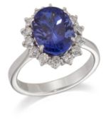 A TANZANITE AND DIAMOND CLUSTER RING