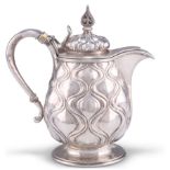 AN ARTS AND CRAFTS SILVER WATER JUG