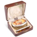 A GEORGE V SILVER-MOUNTED FAUX BLONDE TORTOISESHELL BRUSH AND COMB SET