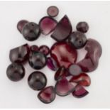 A QUANTITY OF GARNET BEADS AND CABOCHONS