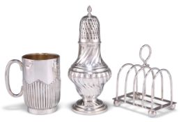 A SILVER SUGAR CASTER, MUG AND TOAST RACK