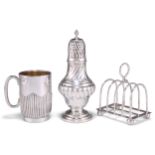 A SILVER SUGAR CASTER, MUG AND TOAST RACK