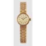 A LADY'S 9 CARAT GOLD OMEGA BRACELET WATCH