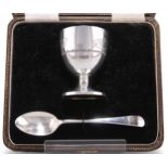 A GEORGE VI CHRISTENING SILVER EGG CUP AND SPOON