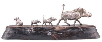 A STERLING SILVER SCULPTURE, "WARTHOG FAMILY RUNNING"