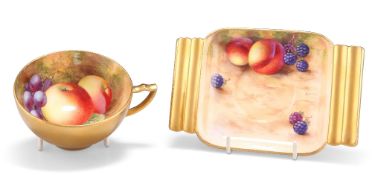 A ROYAL WORCESTER FRUIT PAINTED CUP AND SAUCER