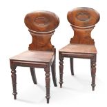 A PAIR OF REGENCY MAHOGANY HALL CHAIRS