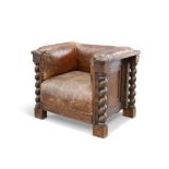 AN EARLY 20TH CENTURY OAK AND LEATHER CLUB CHAIR