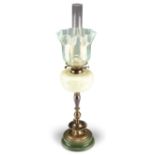 A LATE VICTORIAN BRASS AND VASELINE GLASS OIL LAMP