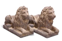 A PAIR OF RECONSTITUTED STONE LIONS