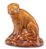 A 19TH CENTURY BROWN SALT-GLAZED MODEL OF A MONKEY