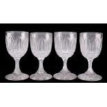 A SET OF FOUR VICTORIAN CUT GLASS WINE GLASSES