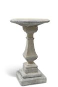 A RECONSTITUTED STONE BIRD BATH