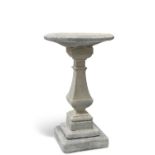 A RECONSTITUTED STONE BIRD BATH