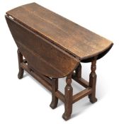 AN 18TH CENTURY OAK GATELEG DINING TABLE