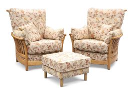 A PAIR OF ERCOL 'RENAISSANCE' LIGHT ELM LOUNGE CHAIRS AND FOOTSTOOL