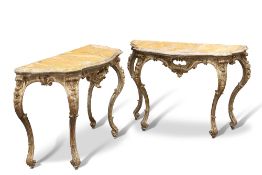 A PAIR OF CONTINENTAL GILTWOOD AND FAUX MARBLE CONSOLE TABLES