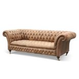 A VICTORIAN-STYLE DEEP-BUTTONED BROWN LEATHER CHESTERFIELD