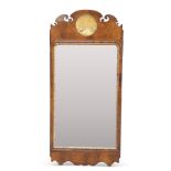 A GEORGE II-STYLE PARCEL-GILT WALNUT FRETWORK MIRROR