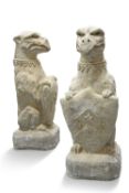 A PAIR OF RECONSTITUTED STONE HERALDIC GRIFFINS