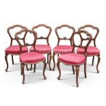 A SET OF SIX VICTORIAN WALNUT BALLOON-BACK DINING CHAIRS